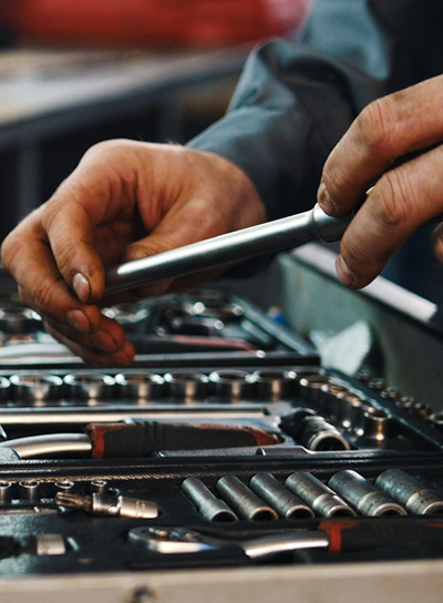 Man Changing Socket Wrench, Tools